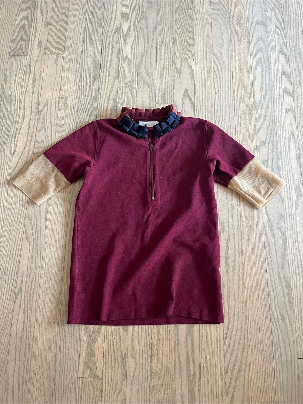 Ikram Toga Archives half zip Top and Ruffle Collar